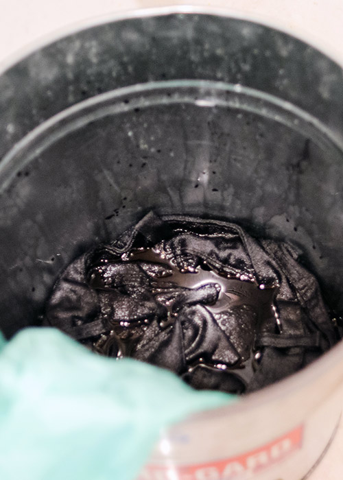 dyeing jeans in a bucket