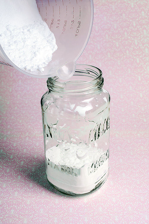 Pouring your DIY deodorant mixture into a mason jar 03 pour that mixture into the jar