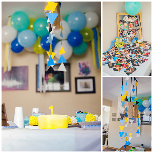 Smash cake in waiting, with balloon cluster, triangle garland, and cupcakes. Picture frame bursting with Johnny's pics.